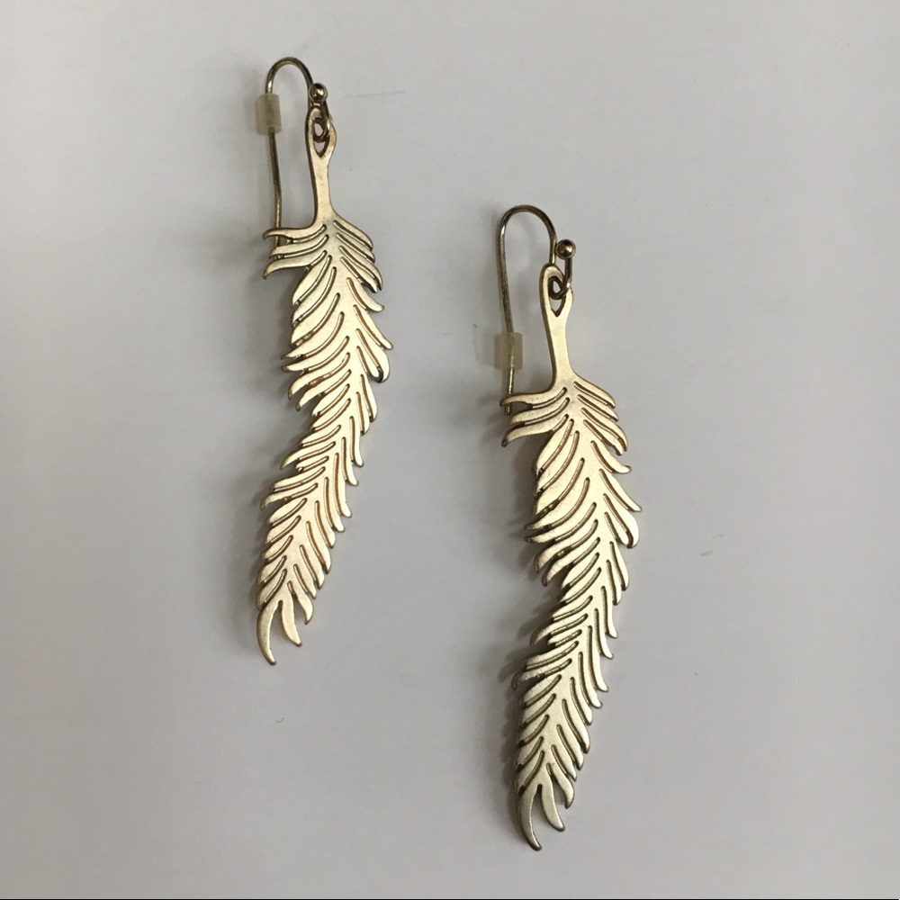 Anthropologie gold colored metal feather earrings